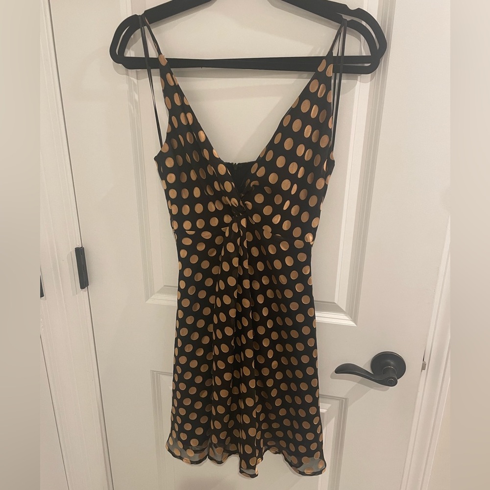 Women’s ASTR mini flare dress. Gold and black polka dot. Size S
